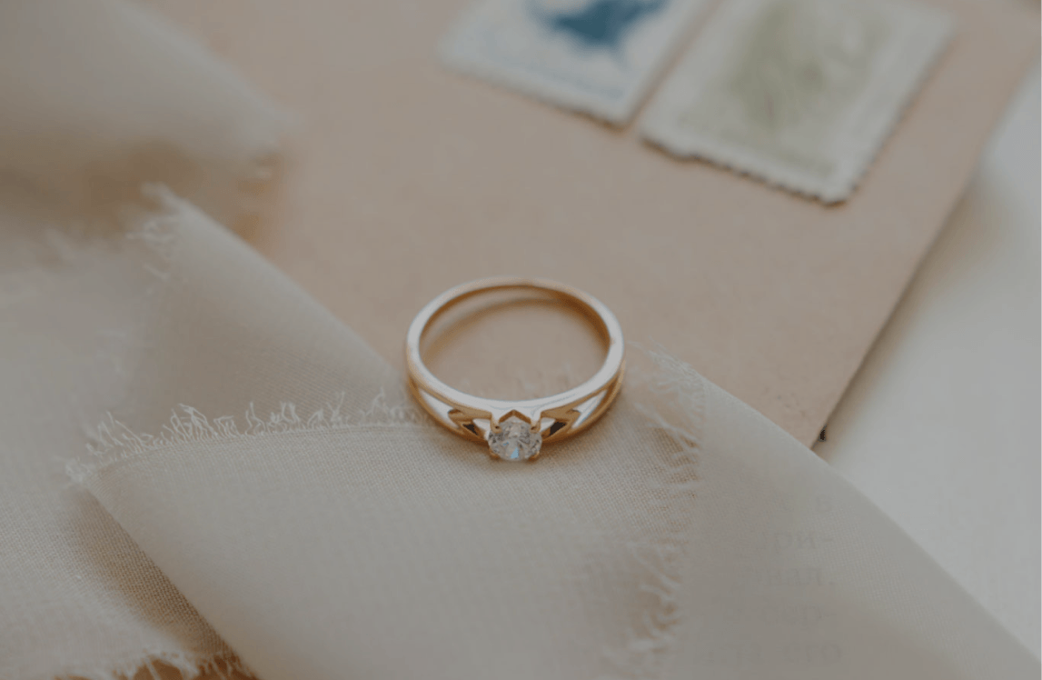 Diamond ring on beige fabric