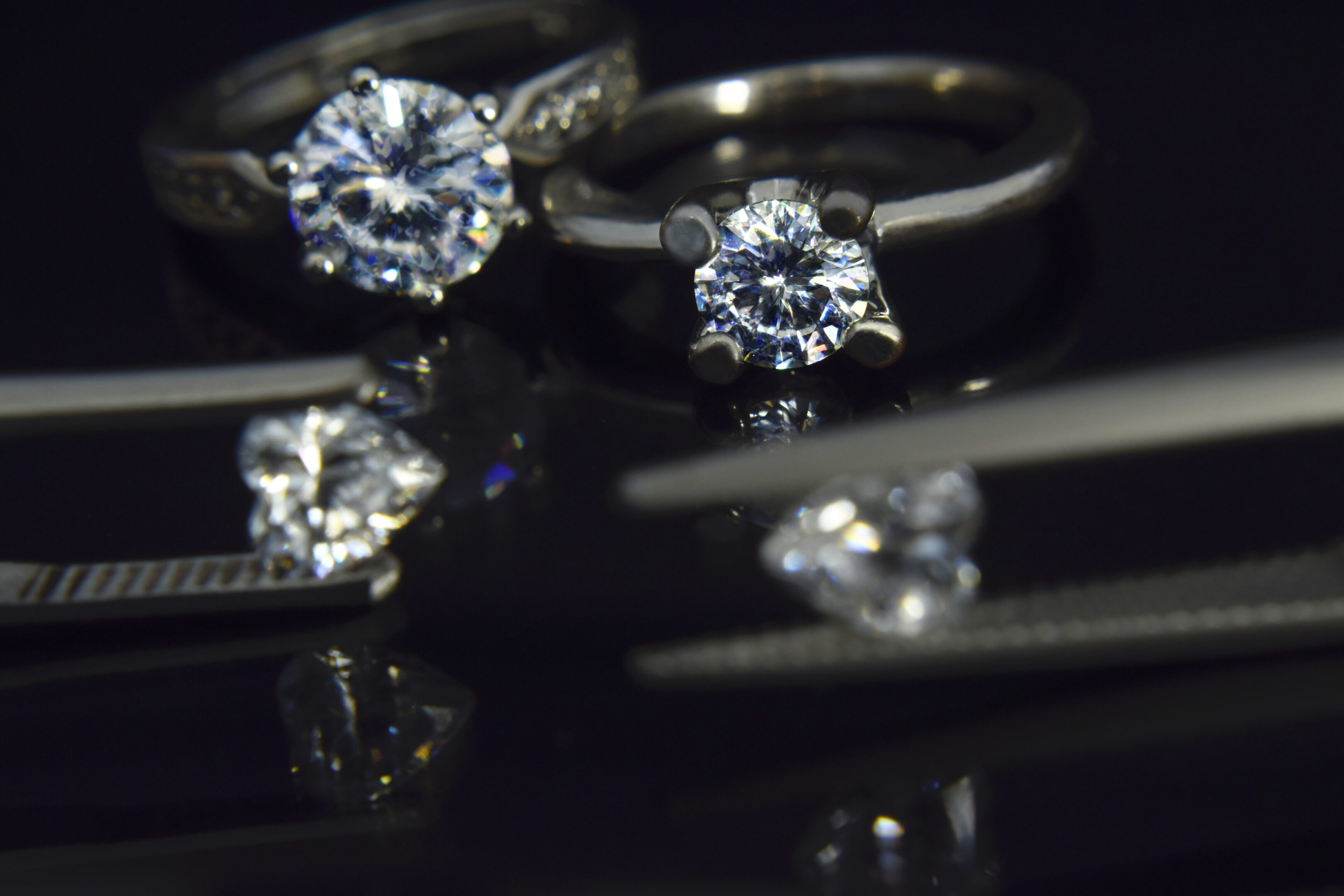 Two diamond engagement rings and loose diamond