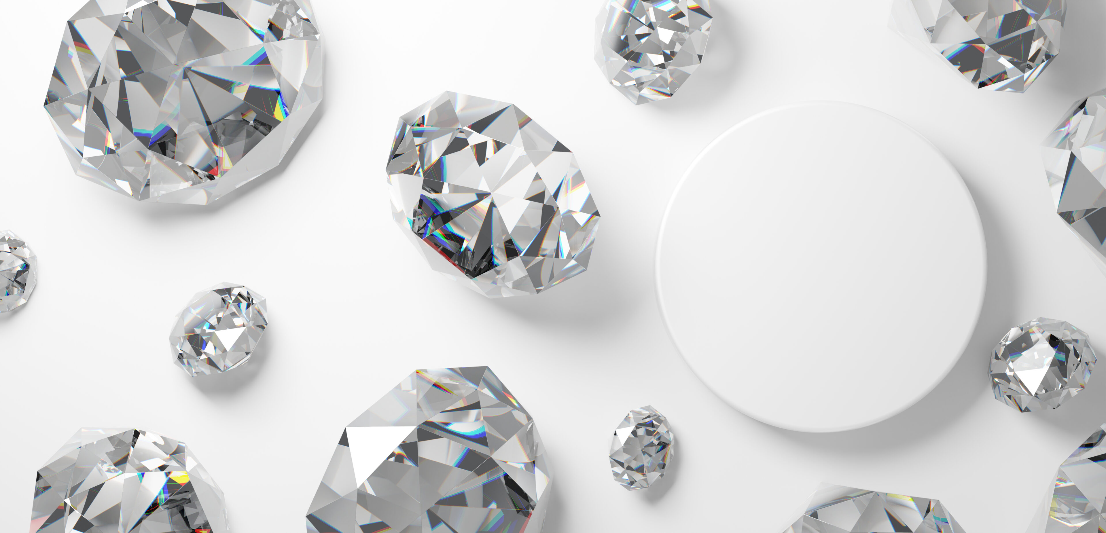 Loose diamonds on white circular display pedestal
