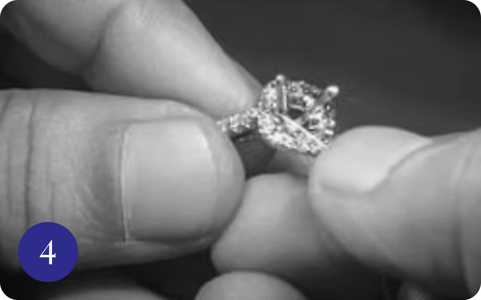 Close-up of hands holding diamond engagement ring